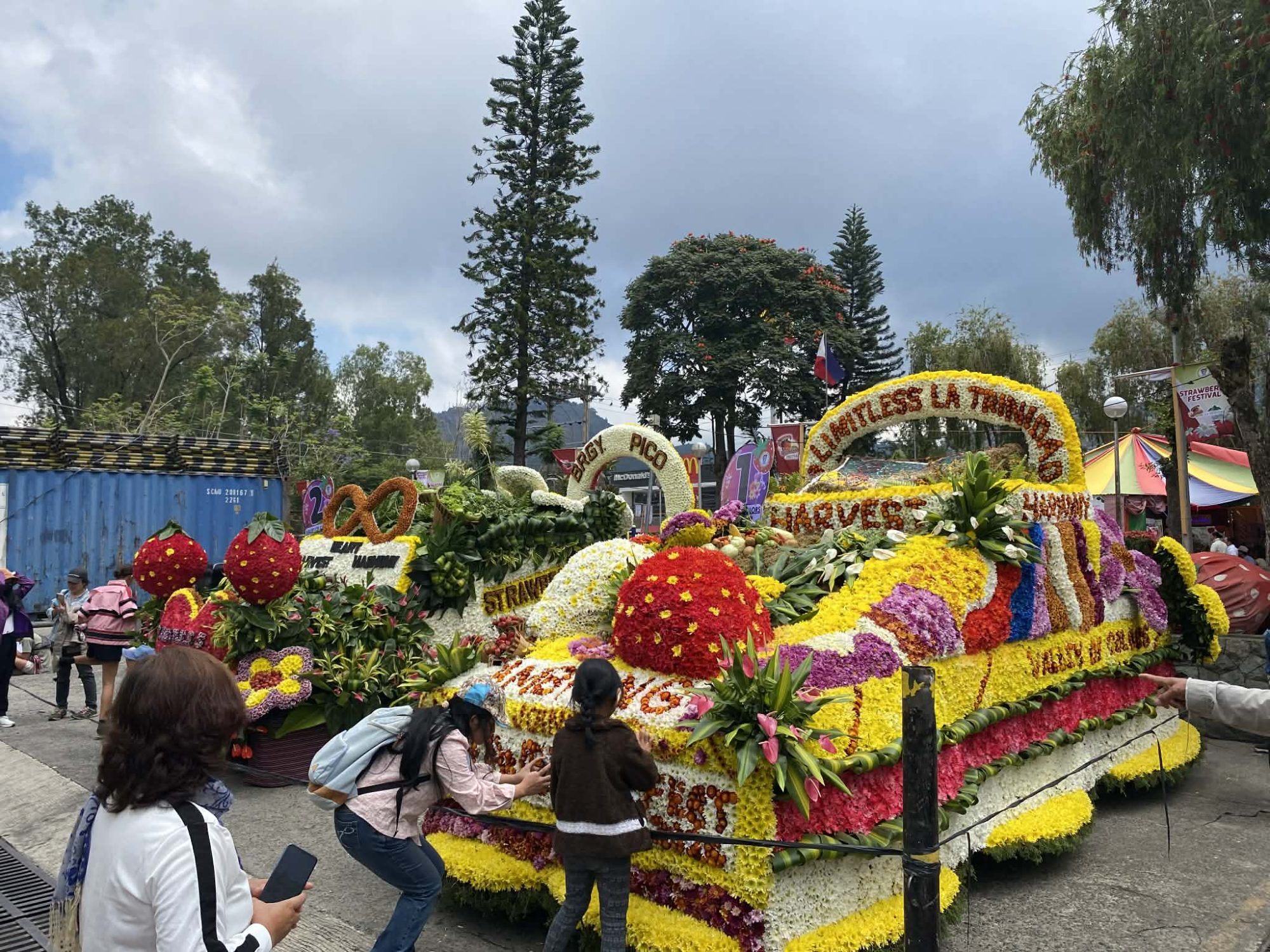 A FLOAT FOR ALL SEASONS. A community-crafted float is on display at the La Trinidad municipal grounds following the Strawberry Festival grand parade. Despite limited subsidies, local participants used resourceful designs to maintain the tradition's visual appeal. Photo by Tuesday Javar/UP Baguio intern